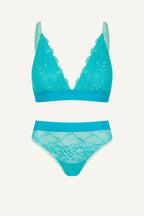 Teal lace bikini set on a white background