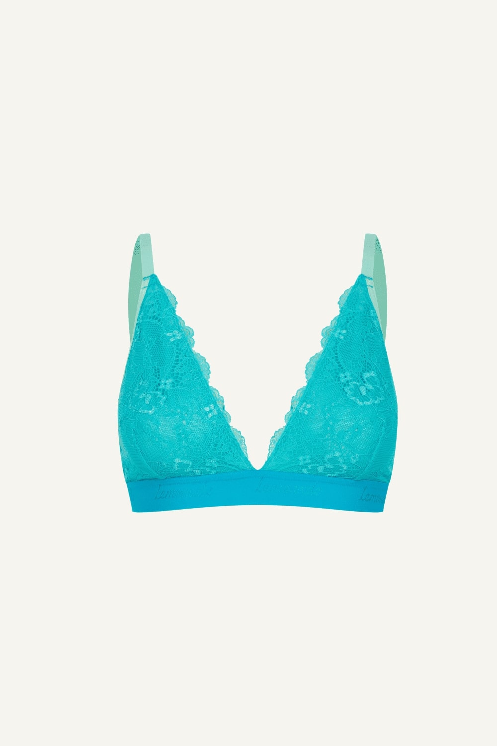 A ghost image of the front of a bright blue lace bralette 