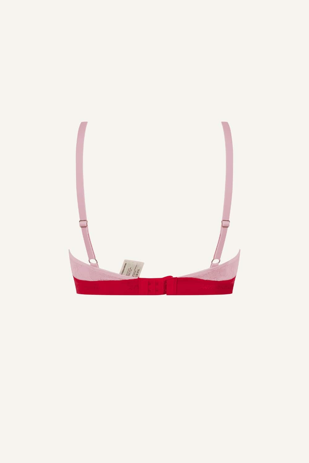 A ghost image of the back of a light pink and red ace bralette 