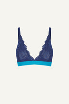 A ghost image of the front of a blue lace bralette 