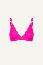 A ghost image of a neon pink lace bralette 