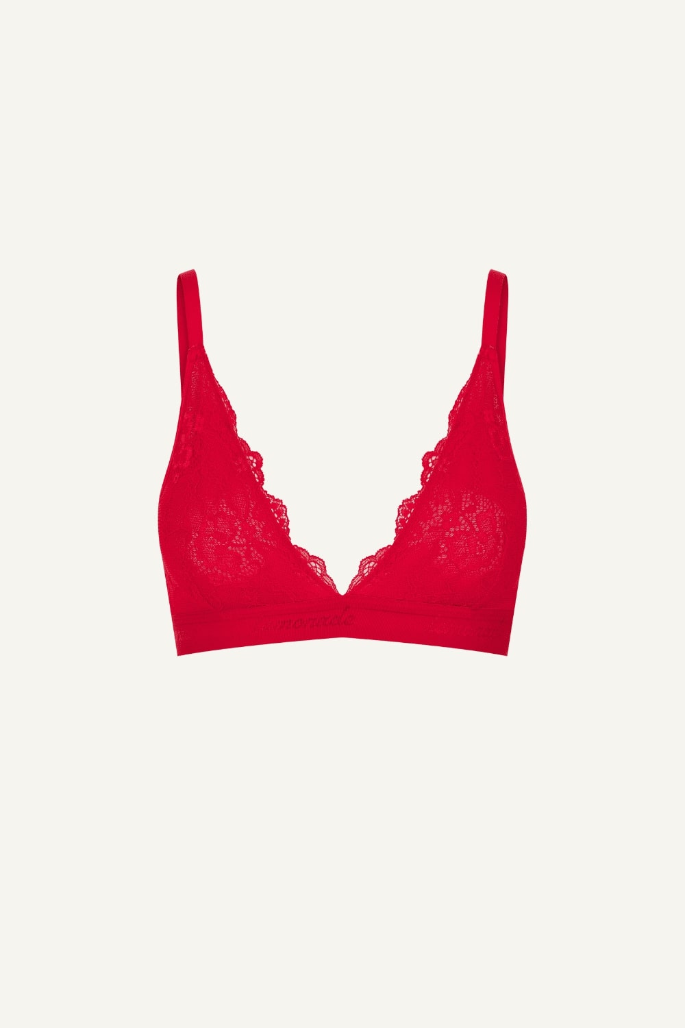 A ghost image of the front of a red lace bralette 