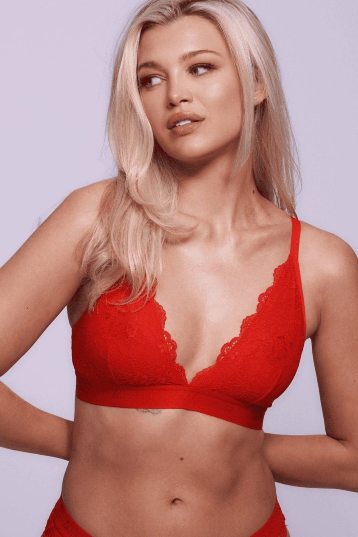 A woman wearing a red lace bralette ^Lauren | Size: 32 B / 8