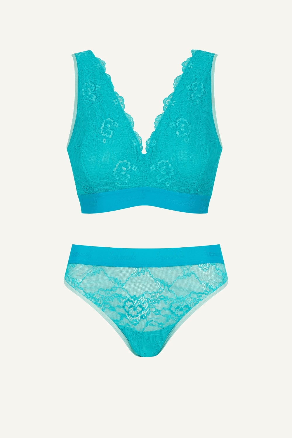 Teal lace lingerie set on a light gray background