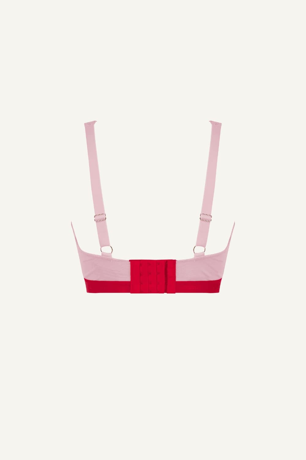 A ghost image of the back of a light pink and red lace fuller cup bralette 