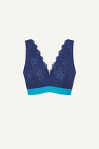 A ghost image of the front of a blue lace fuller cup bralette with a light blue band 