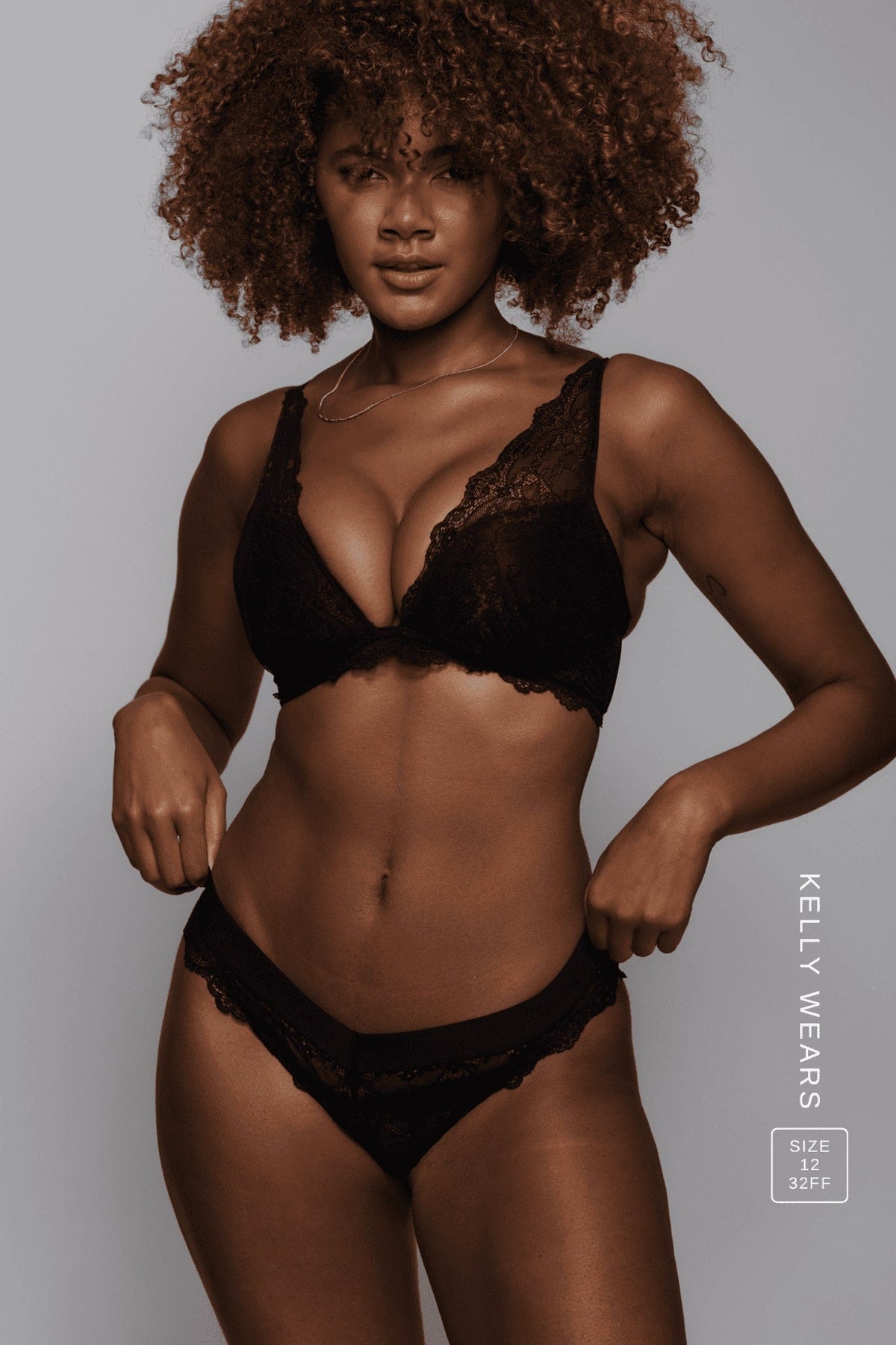 A woman wearing a black lace fuller cup bralette paired with a black lace brazilian ^Kelly | Size: 32 FF / 12