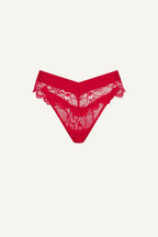 A ghost image of the front of a red lace brazilian knicker 