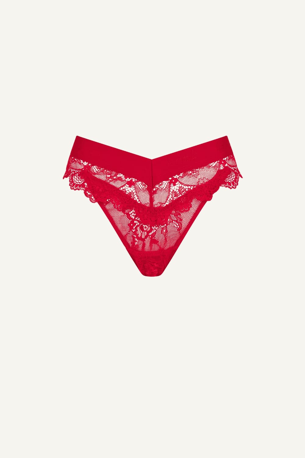 A ghost image of the front of a red lace brazilian knicker 