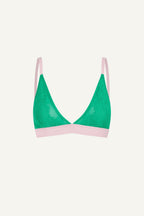 A ghost image of the front of a green lace bralette with pink details on it 