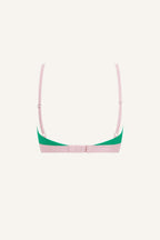 A ghost image of the back of a green lace bralette with pink straps and band 