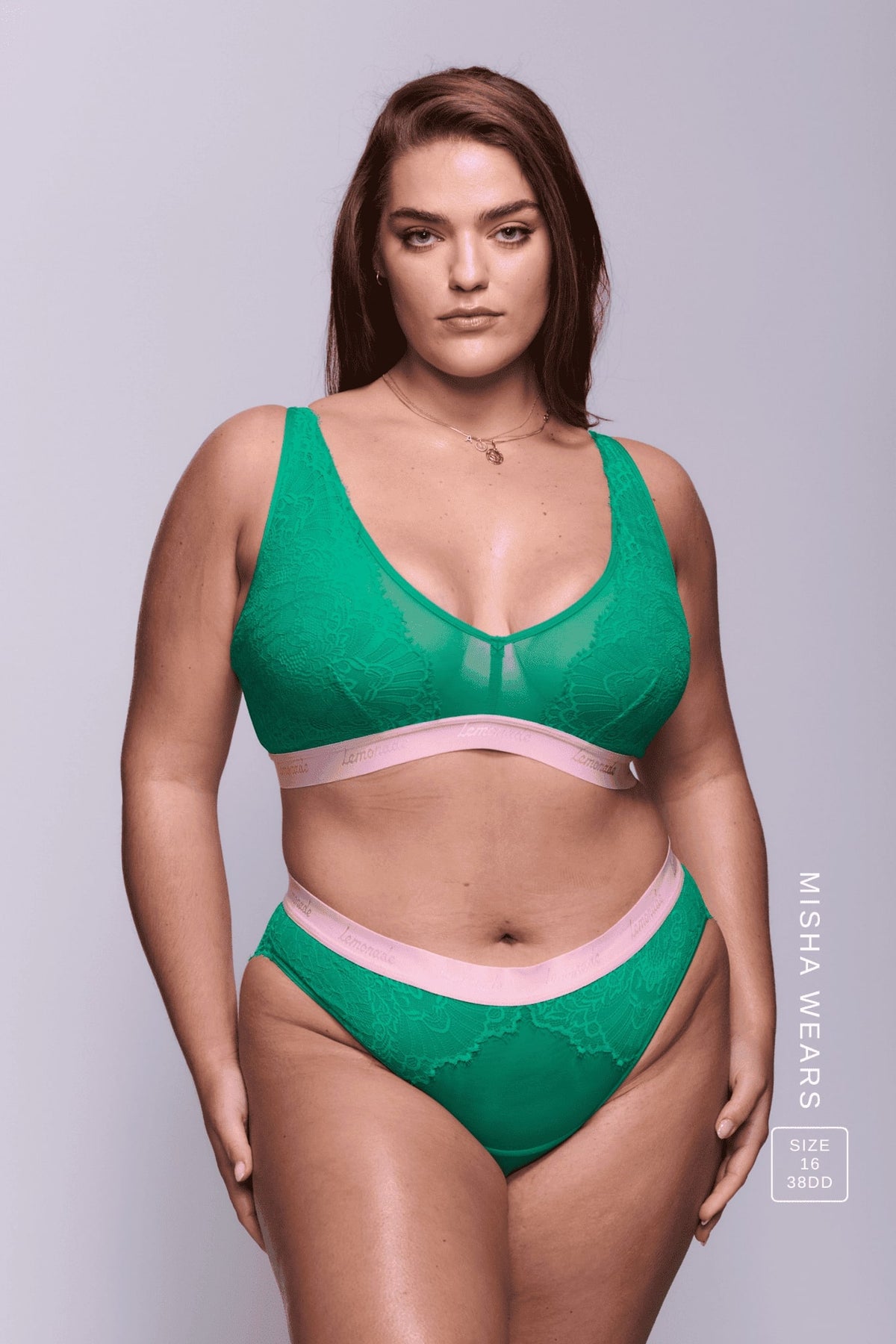 A woman wearing a green lace and mesh lingerie set ^Misha | Size: 38 DD / 16