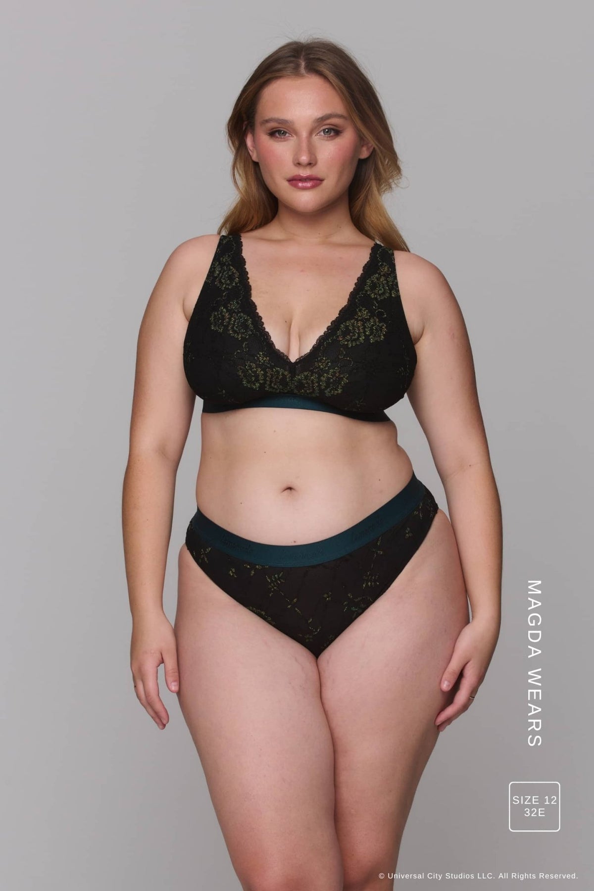 A woman modelling a dark lingerie set