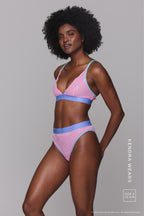 a woman wearing a multi pastel coloured lingerie set