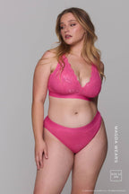 A woman modelling a pink lace lingerie set ^Magda | Size: 32 E / 12